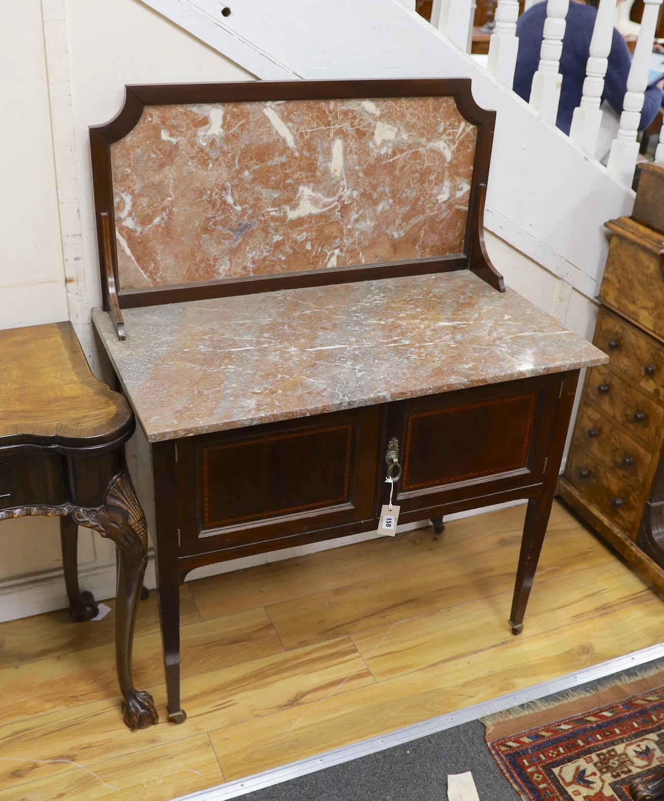An Edwardian mahogany marble topped washstand, width 91cm, depth 51cm, height 122cm